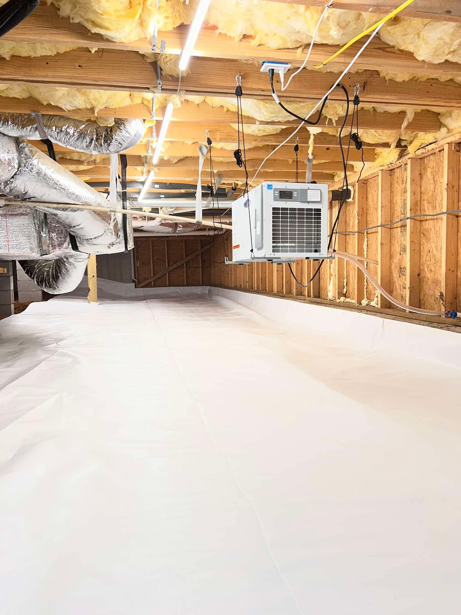 Crawl space moisture control system with dehumidifier